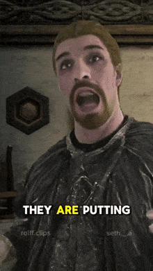 a man with a beard says they are putting on a screen