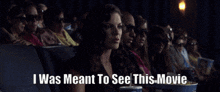 a group of people are watching a movie and a woman says i was meant to see this movie
