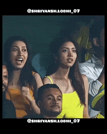 a woman in a yellow tank top stands in a crowd with the hashtag shriyansh.lodhi_07