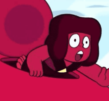 a cartoon character is laying on a red surface with his head on a red ball .