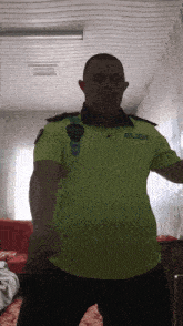 a man wearing a yellow shirt with the word polis on the front