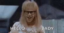 a man with blonde hair and glasses is smiling and saying `` hello foxy , lady '' .