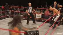 a wrestling ring with a sign that says sucka