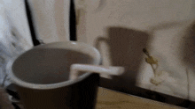 a straw is sticking out of a cup of coffee