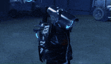 a person in a black suit with a blue light on their face