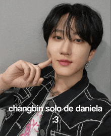 a picture of a young man with the caption changbin solo de daniela 3