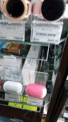 a display case filled with various electronics including a smart watch