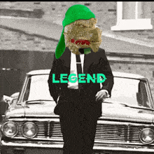 a man in a suit and tie is standing in front of a car with the word legend written on it
