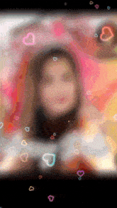 a blurry picture of a girl with hearts floating around her