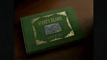 a green book titled yoshi 's island sits on a brown table