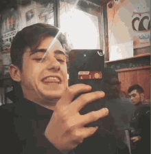 Laughing Looking At Phone Laughing GIF