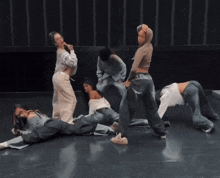 a group of dancers are performing on a stage and one of them is wearing a hoodie that says ' ld '
