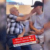 an older man is putting a sticker on a younger man 's face that says mon alarme les lundis matin