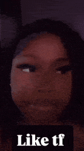 a close up of a woman 's face with the words like tf below