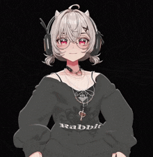 a girl wearing headphones and a sweater that says rabbit on it