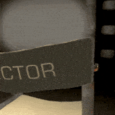 a director 's chair with a bullet hole in the back of it