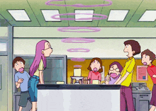 a group of people are standing around a counter in a room