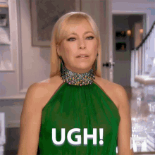a woman in a green dress with the word ugh on her shirt