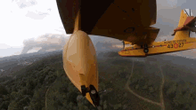 a yellow plane with reino de espana written on the side