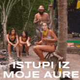 a group of people sitting under a palm tree with the words " istupi iz moje aure " in white letters