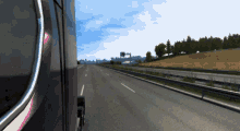 a truck is driving down a highway with a sign that says ' a ' on it