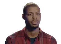a man in a red plaid shirt is smiling for the camera