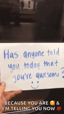 a person is holding a card that says has anyone told you today that you 're awesome