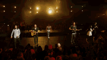 a blurry picture of a person holding a microphone