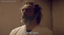 a man with curly hair and a beard says " clever girl "