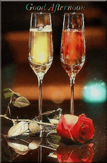 a good afternoon greeting card with two wine glasses and a red rose