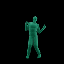 a green mannequin is dancing in the dark