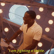 a man says i am fighting a battle in yellow letters