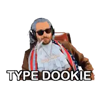 a man wearing a wig and sunglasses is sitting in a chair with the words type dookie above him