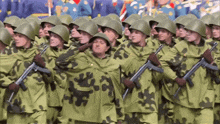 a group of soldiers marching in a line holding their guns