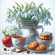 a bouquet of snowdrop flowers sits next to a cup of tea and a bowl of cookies