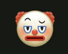 a close up of a clown 's face with red hair and blue eyes on a black background .