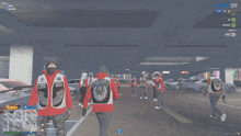 a screenshot of a video game shows a group of men wearing red jackets with the letters cb on them