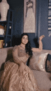 a woman is sitting on a couch with her eyes closed