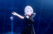 a girl in a black dress is standing in front of a blue wall .