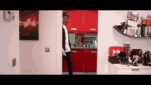 a kitchen with red cabinets and a sign that says coffee on it