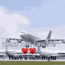 a plane taking off with the words times are crazy have a safe flight below it