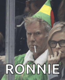 a man in an elf costume smoking a cigarette with the name ronnie written above him
