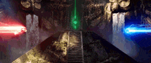 a room with stairs leading up to a green light and a blue light