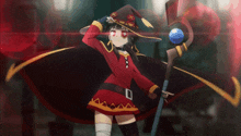 a girl in a witch costume holds a cane
