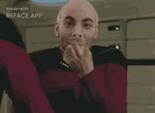 a man in a star trek uniform is making a funny face with his hands .