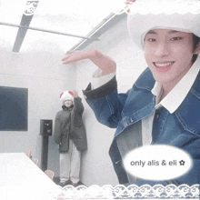 a picture of a man wearing a santa hat with the words only aliis & eli on the bottom right