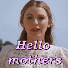 a woman in a white dress says hello mothers in pink