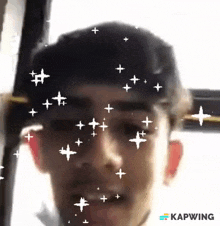 a close up of a man 's face with the word kapwing on the bottom right