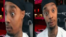 a man is making a funny face in front of a sign that says " 15 "