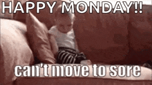 a baby is sitting on a couch with the words `` happy monday !! can 't move to sore '' .